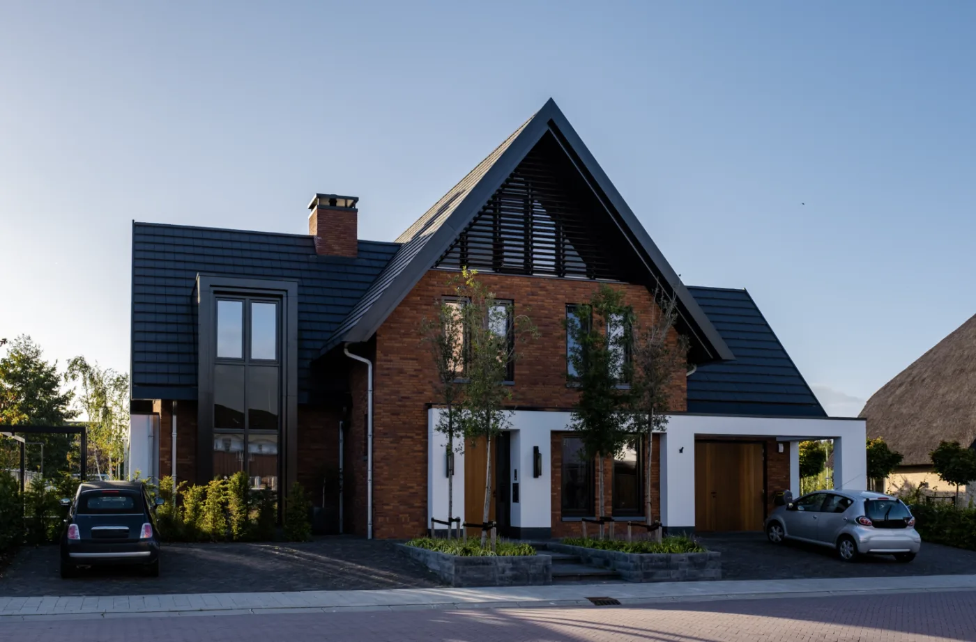 Modern residential house with a white and brick exterior, showcased by Homes for Expats, specialists in helping internationals find homes in the Netherlands